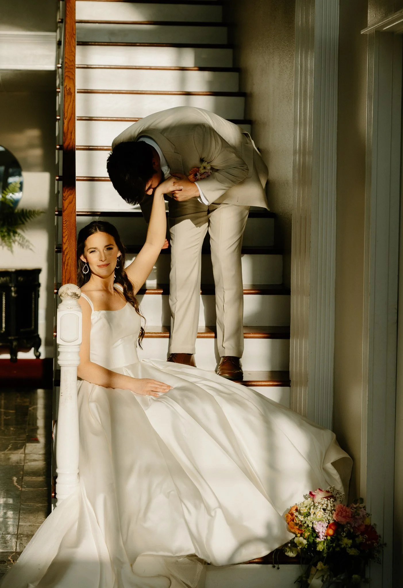 Tupelo, Mississippi church wedding, indoor portraits sitting on stairs of bride and groom.