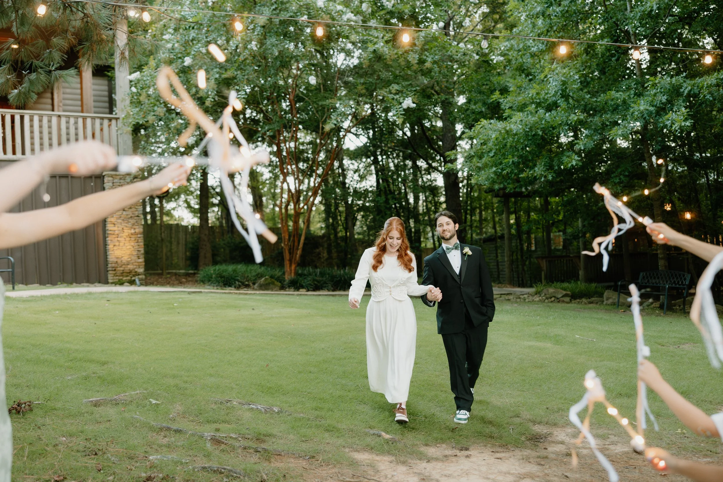 Bride and Groom utilize the front of the lodge as space to implement their grand exit.
