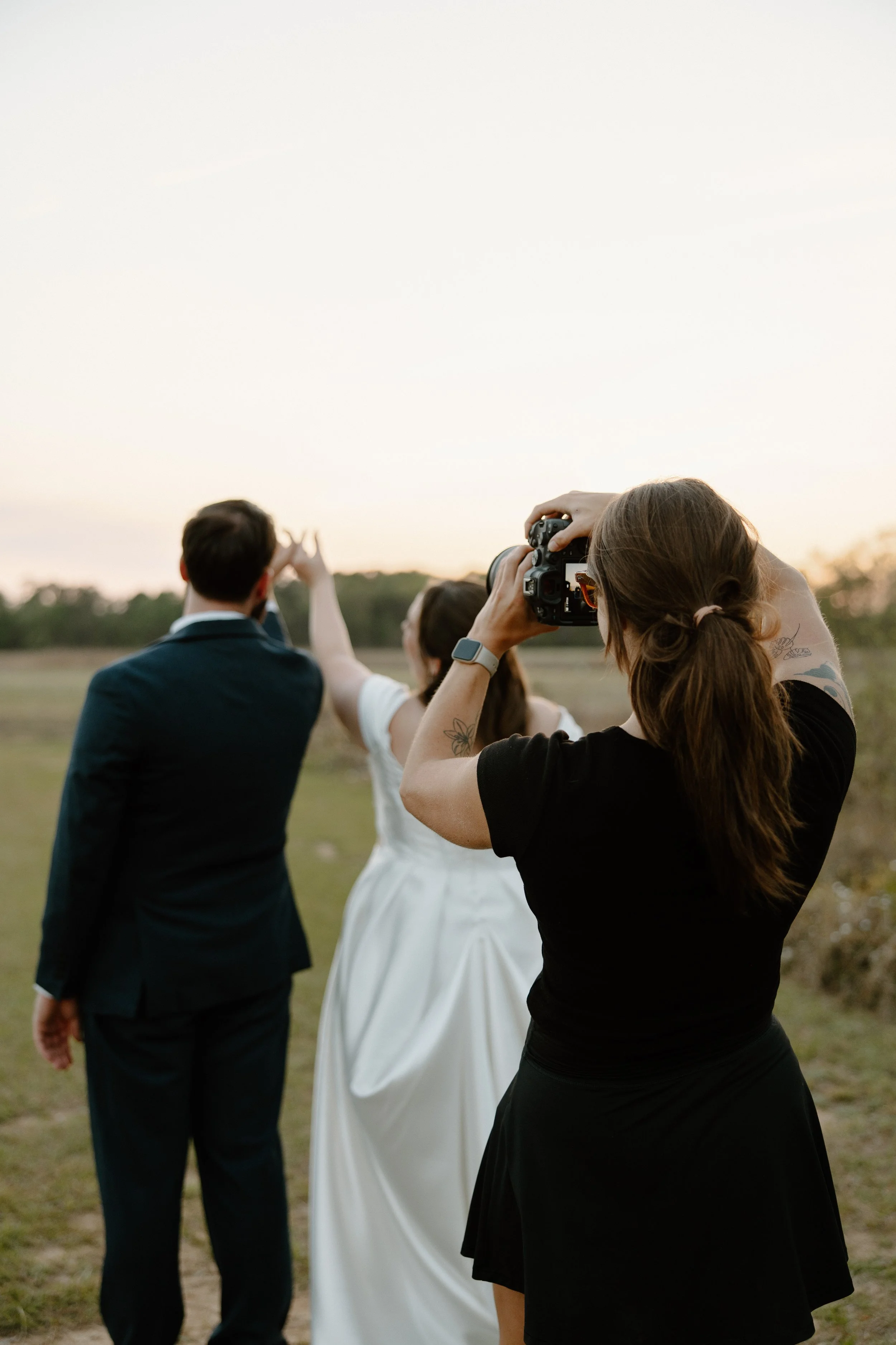 Hannah photographing couple's portraits on a wedding day
