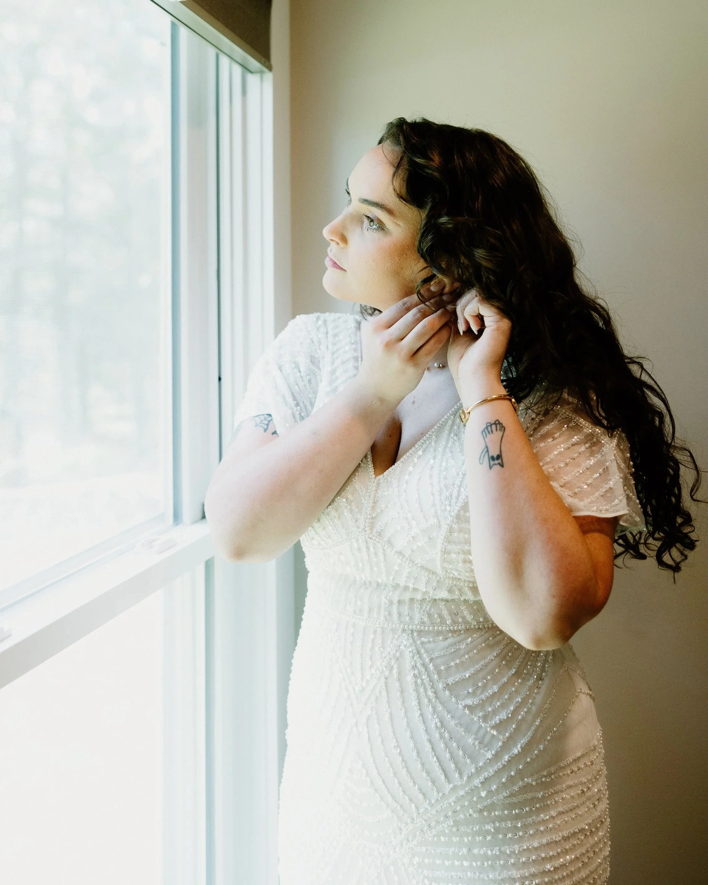 Bridal portraits out of window at oxford airbnb