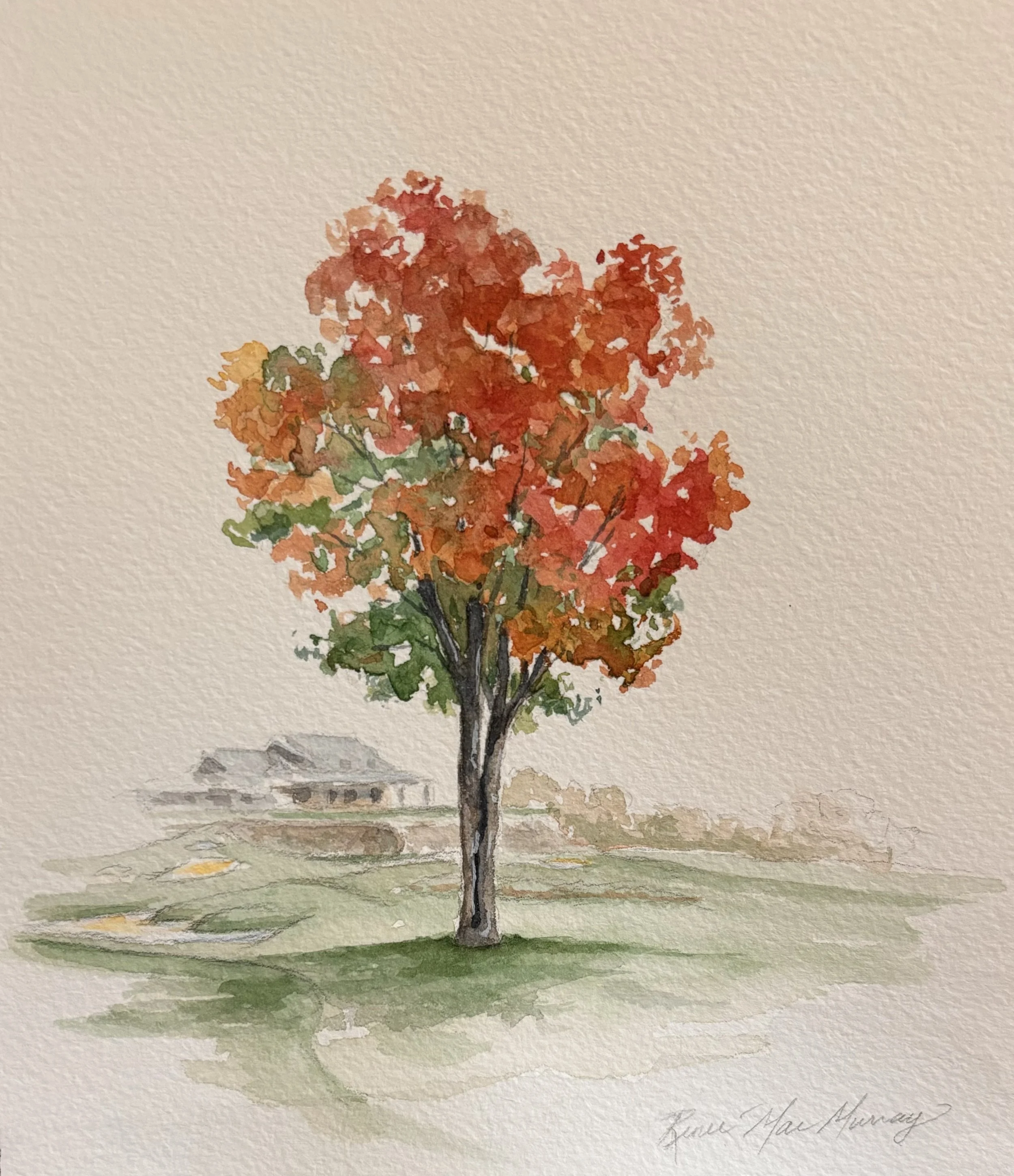 Watercolor painting of a tree with red, orange, and green leaves on a grassy field, with a house in the background.