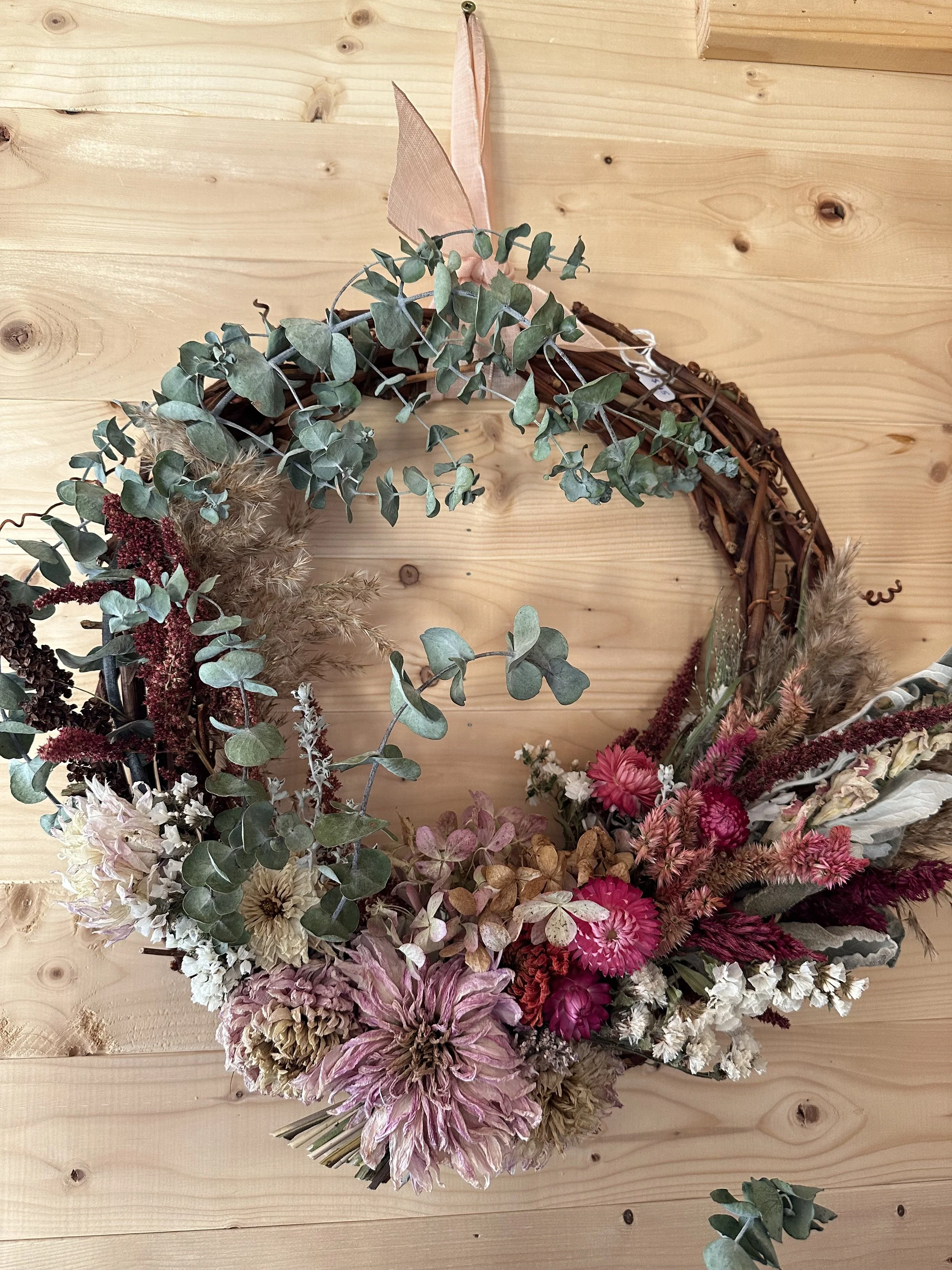 Dried eucalyptus, dahlia, strawflower, celosia, statice, snapdragon