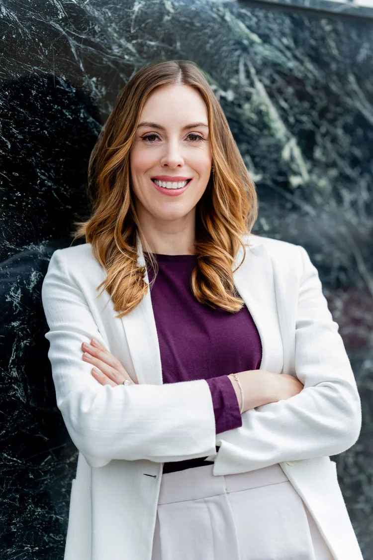 Executive portrait of a woman in a white blazer with arms crossed in San Francisco