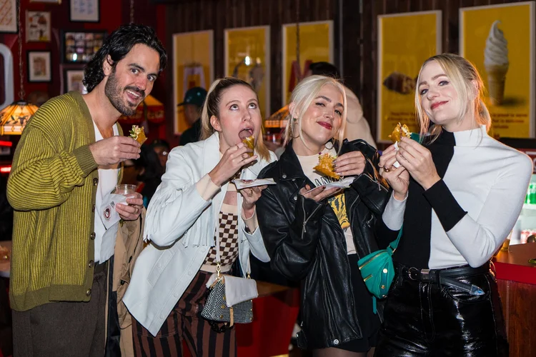 Guests tasting food at a Chain brand event