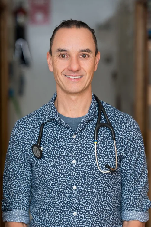 Team headshot of a veterinarian with a stethoscope at a Berkeley vet clinic