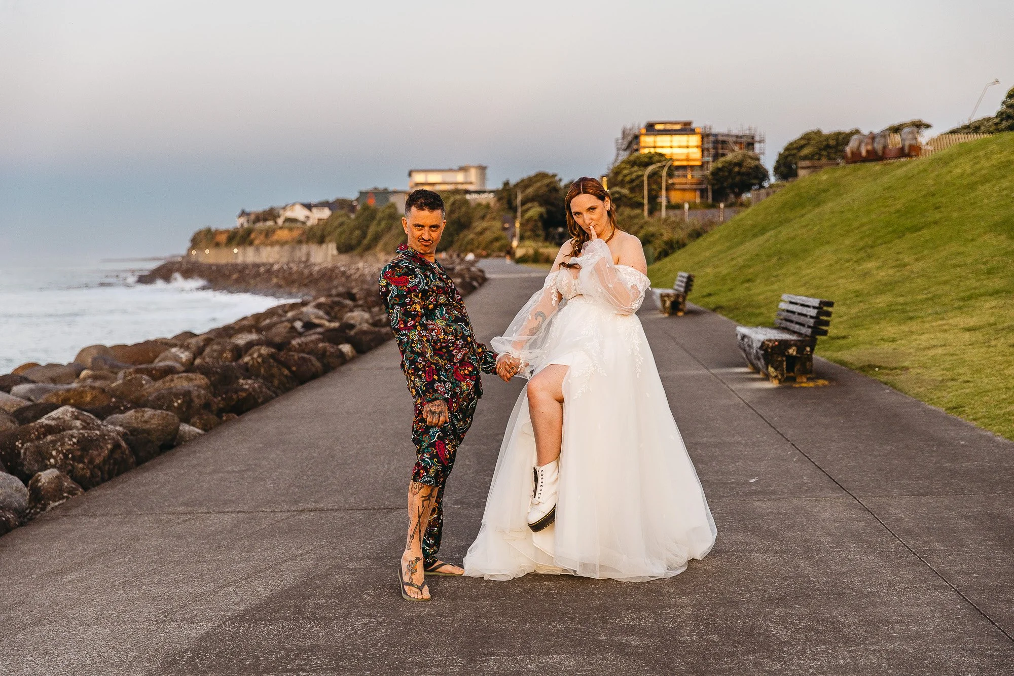 Colourful New Plymouth wedding with vibrant details and a golden coastal sunset.