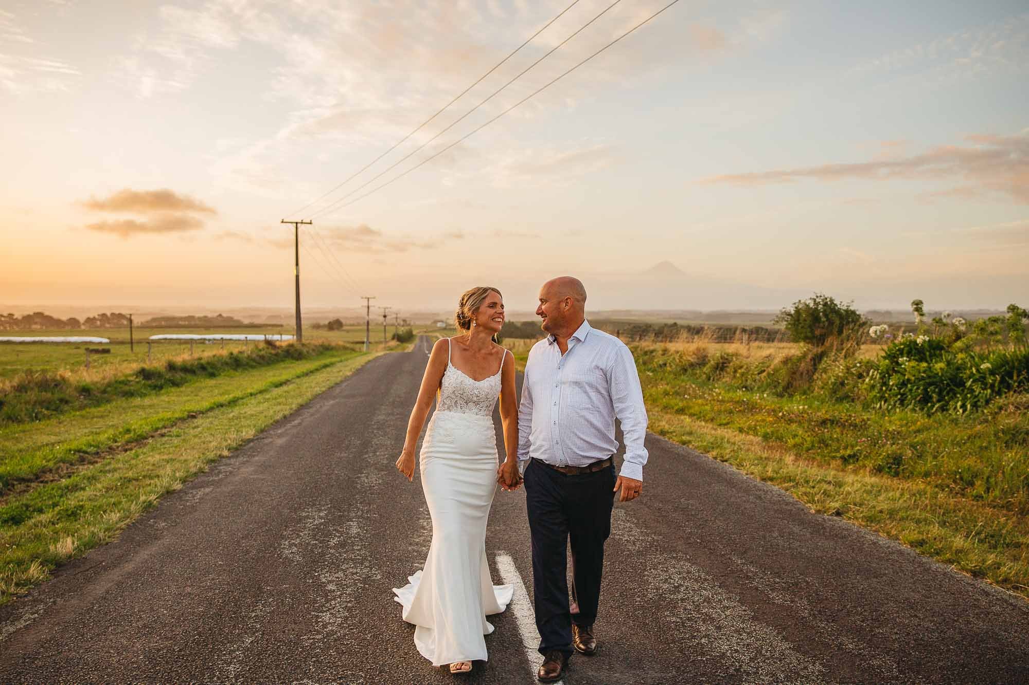 NZ wedding photographer with wedding couple who got married in NZ