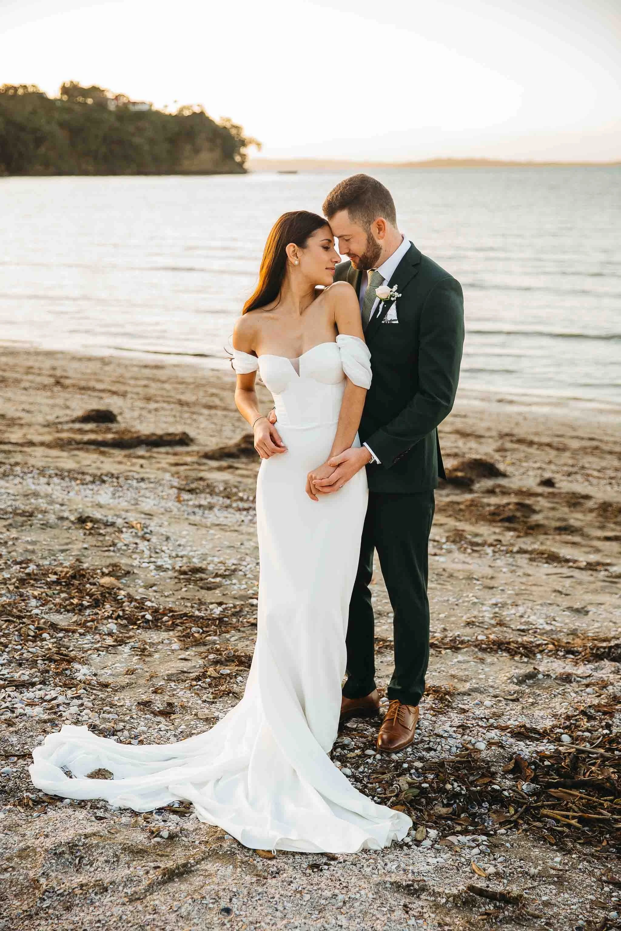 NZ wedding photographer with wedding couple who got married in NZ