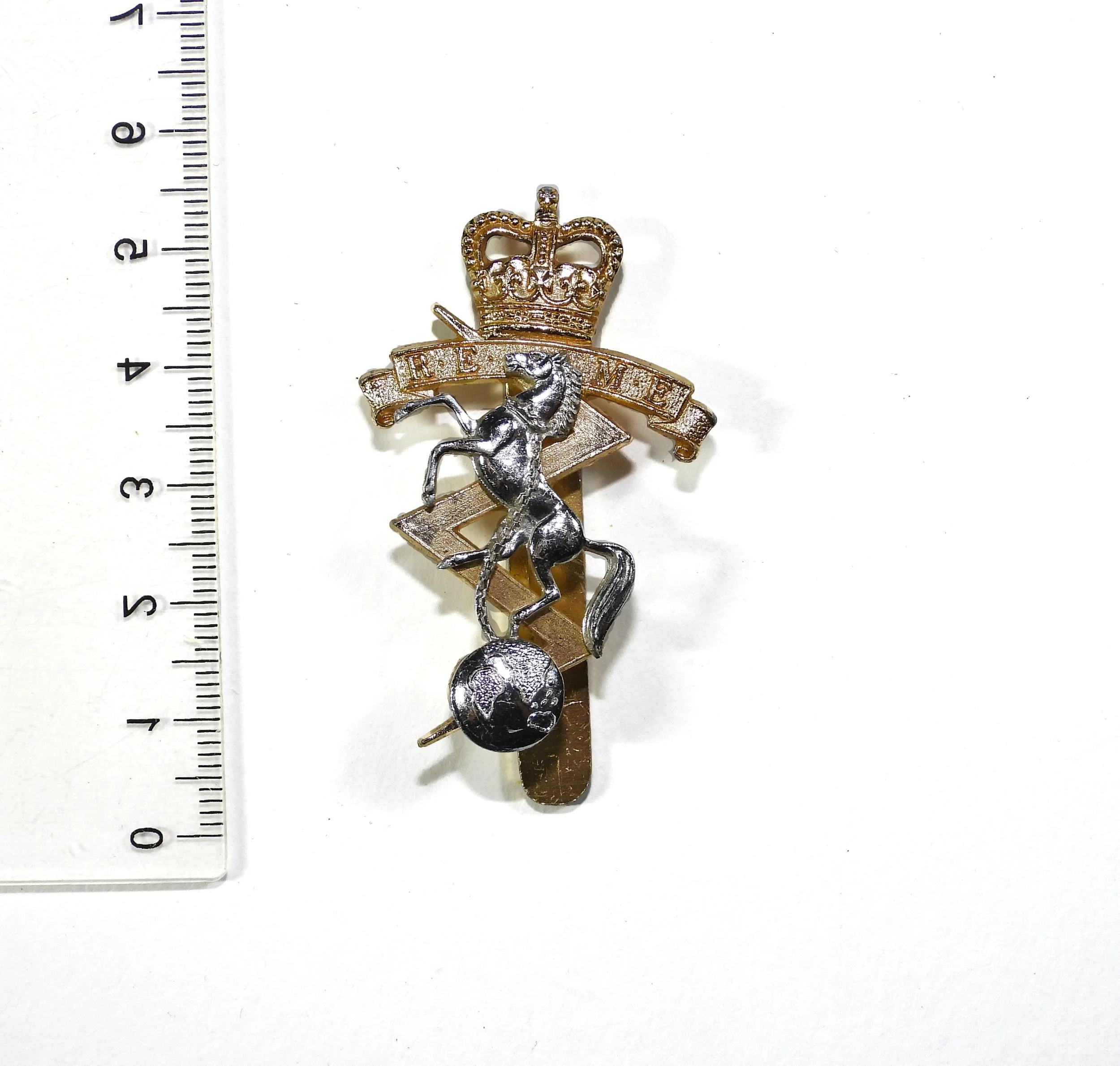 Royal Electrical & Mechanical Engineers Anodised Cap Badge. British Army, United Kingdom.
