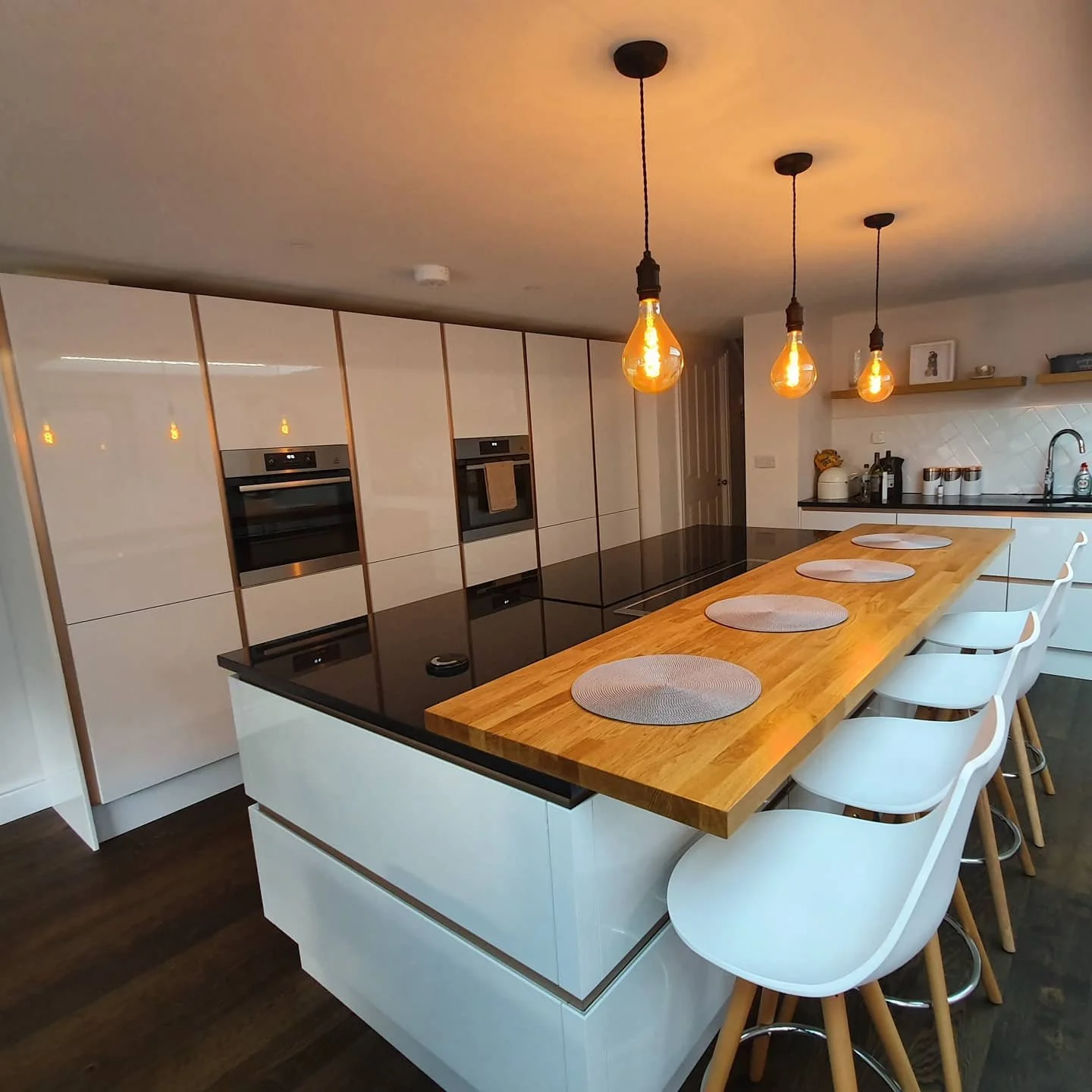 Kitchen with High-gloss handle-less doors and copper details in Bexley
