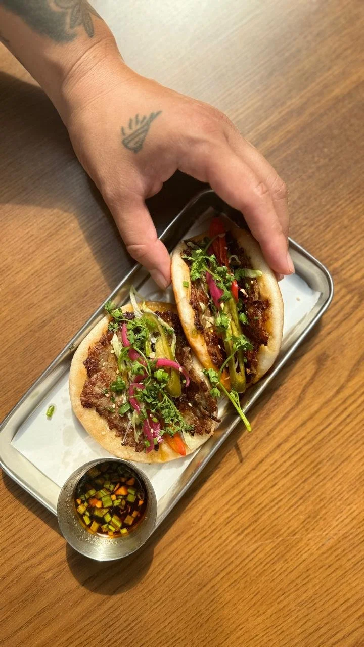 SMASH BAO / two smash fried bao buns, ground pork, truffle mayo, house pickles, cilantro + black truffle vinegar dip - 130,000 VND