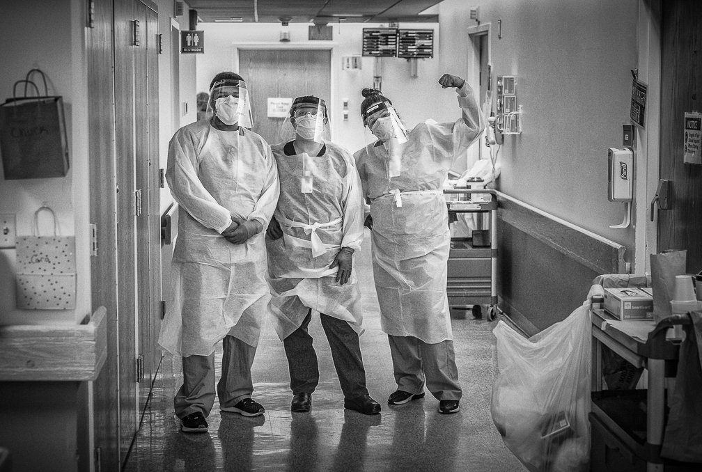 A group of three Covid ICU nurses showing their resiliency as they pose confidently in the ICU."