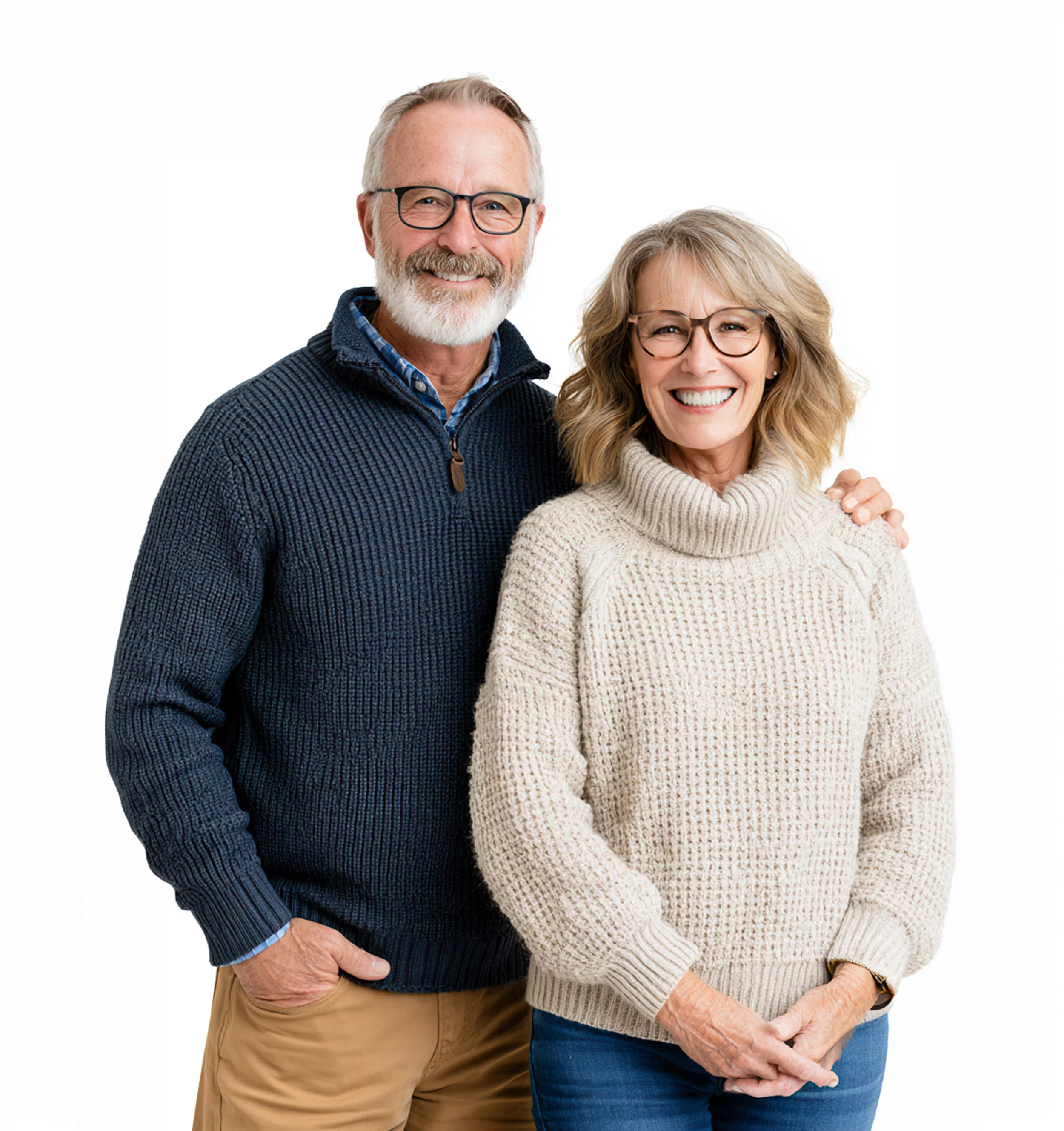 A relaxed portrait of a smiling mature couple standing closely together against a white studio background.