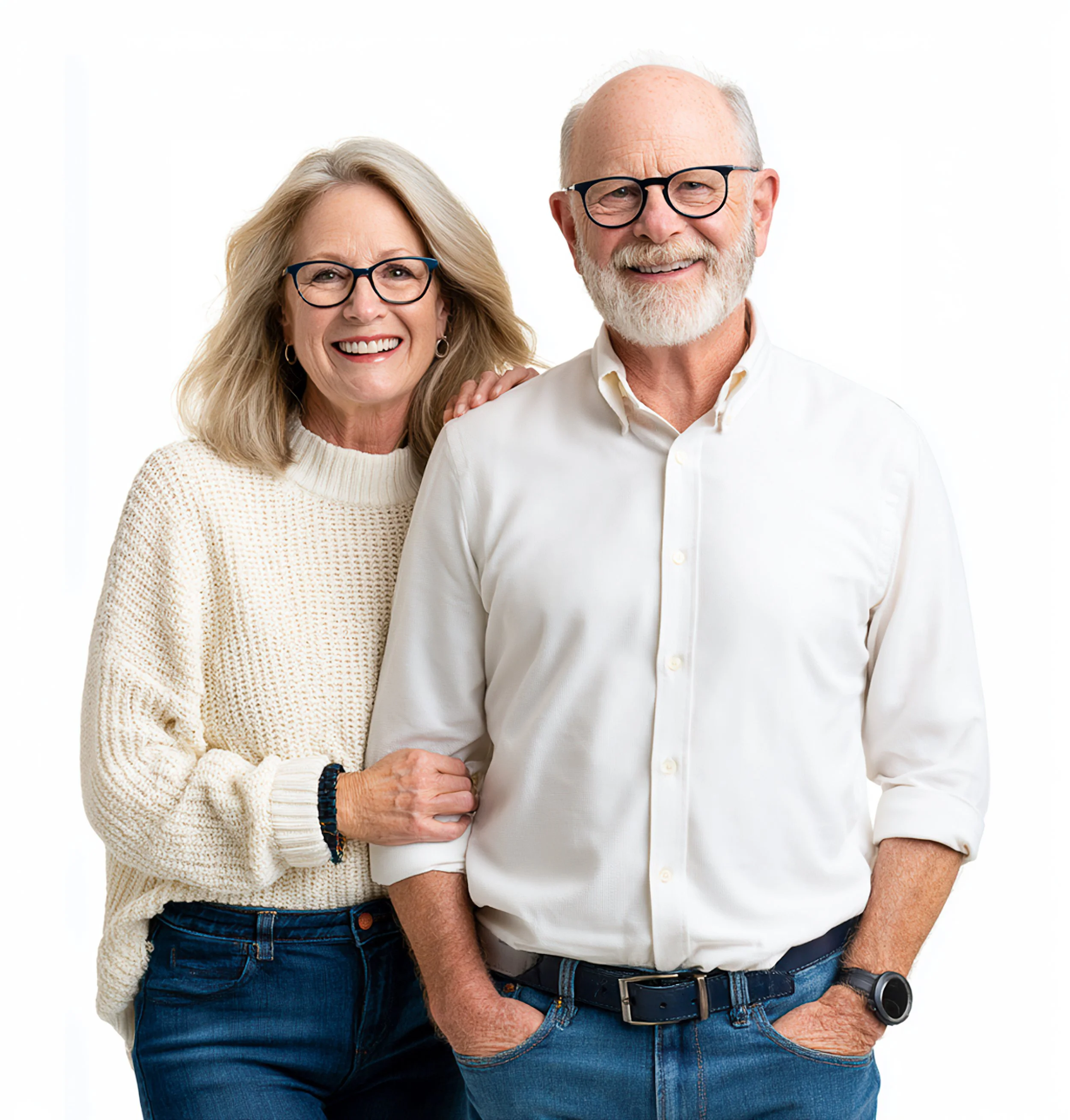 A smiling older couple standing closely together against a bright white studio background.