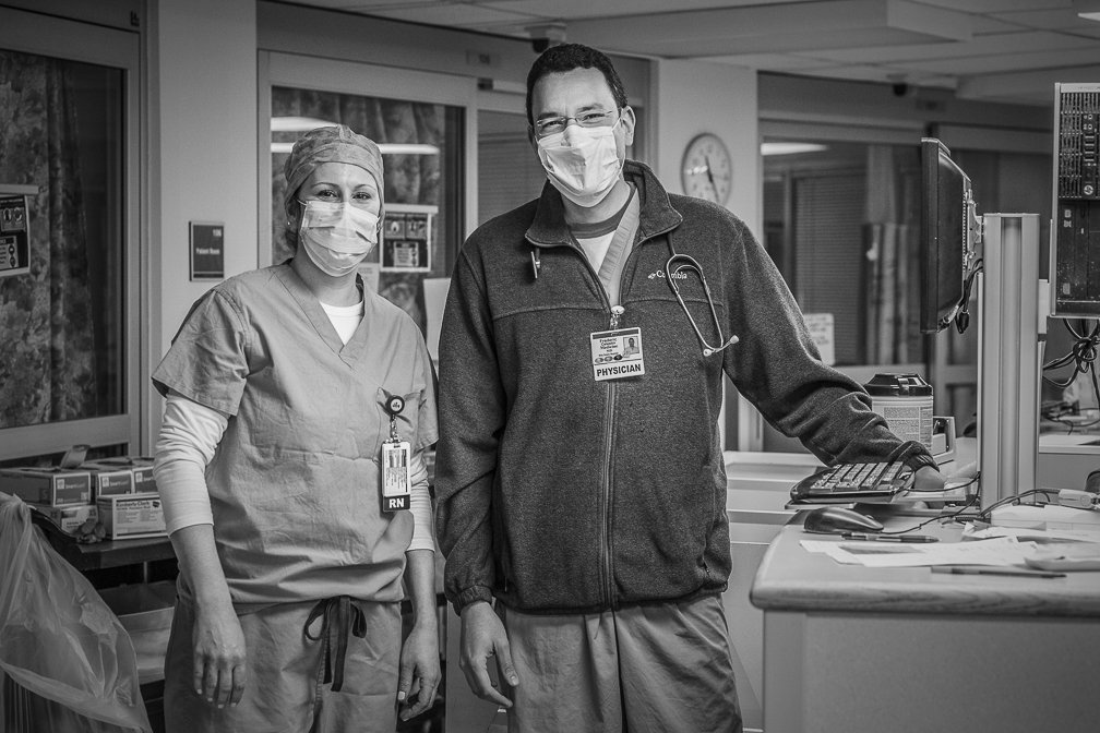 Two doctors looking sharo and optimistic as they smile behind their face masks in the Covid ICU.