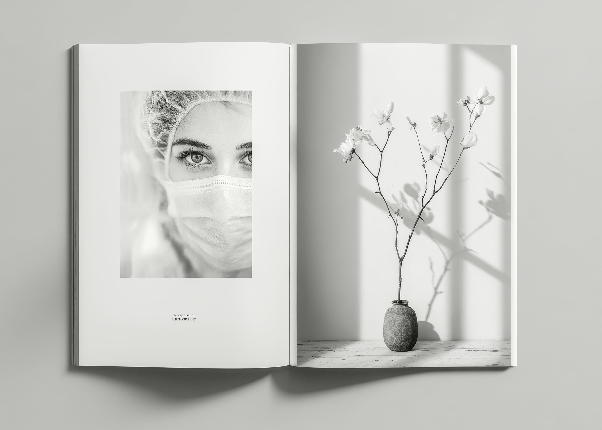 Open book featuring a black-and-white close-up of a woman in a surgical mask and cap opposite flowering branches in a small vase with soft window shadows.