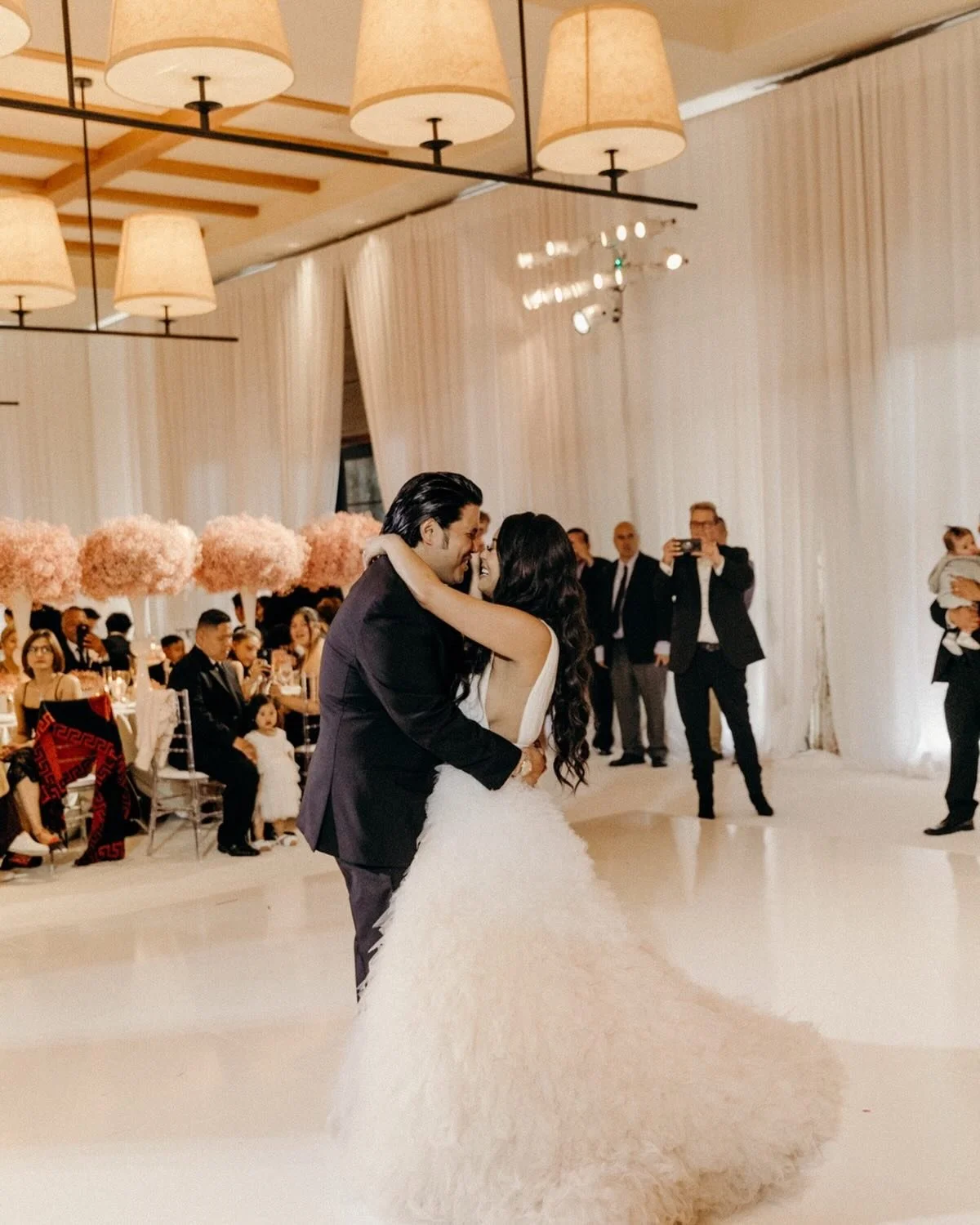 Their first dance always gets me.
Two people finding a shared rhythm
in a room full of noise &mdash;
that&rsquo;s magic.
Maybe that&rsquo;s why I&rsquo;m obsessed with designing moments
that feel like exhale + electricity at the same time.