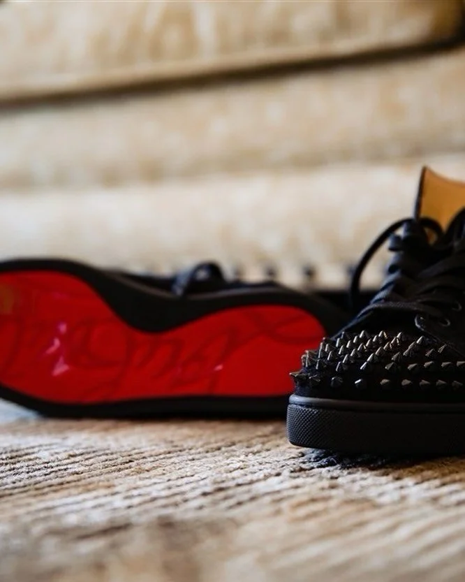 Not every groom wears basic shoes.
Red bottoms. Studded spikes. Still tailored. Still intentional.
I love this because it says something without screaming.
Marriage doesn&rsquo;t mean you lose your edge. It means you choose someone who respects it.
H