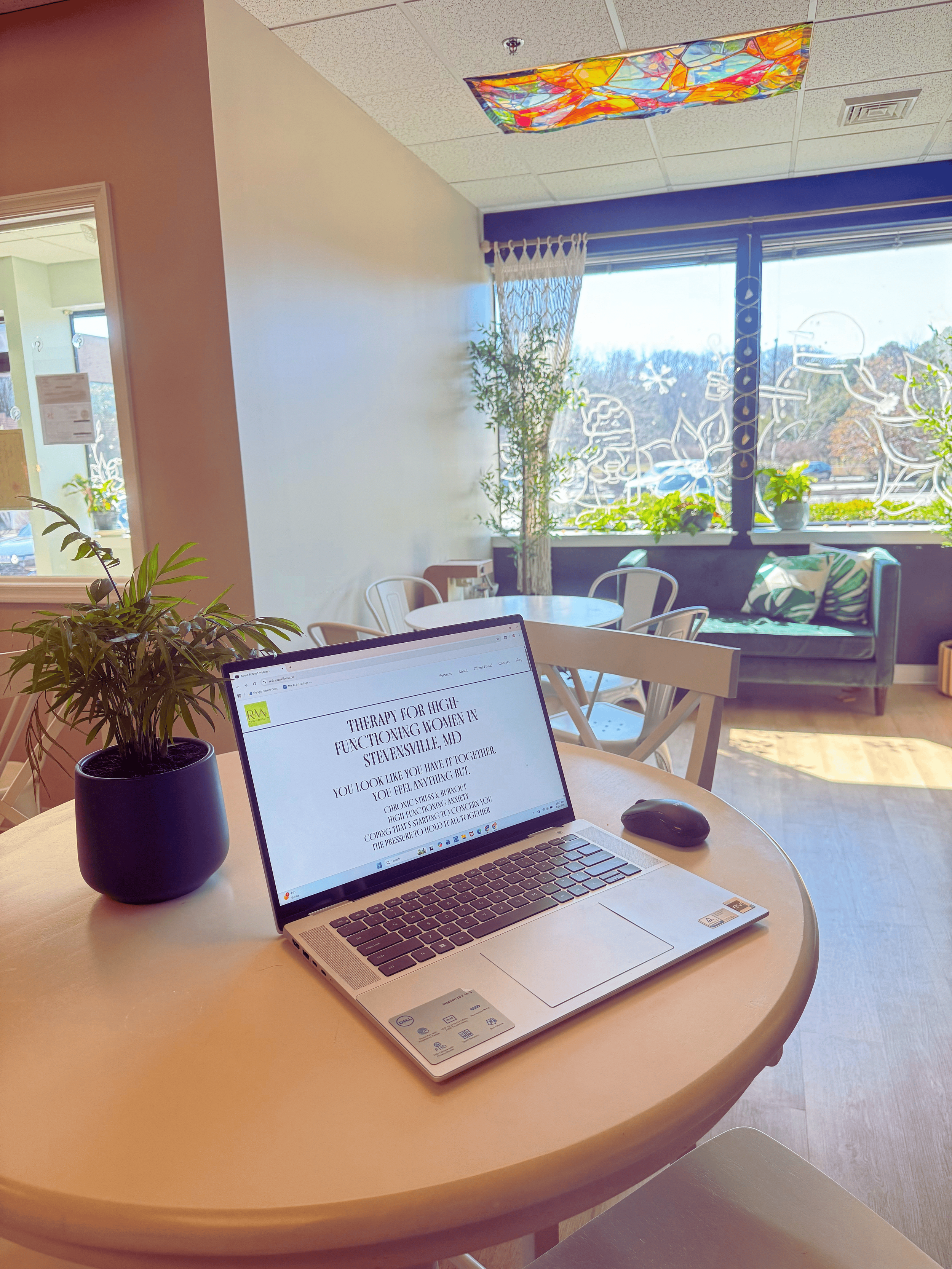 Randi Welch writing her blog post at Herbal Brew Bar Stevensville MD