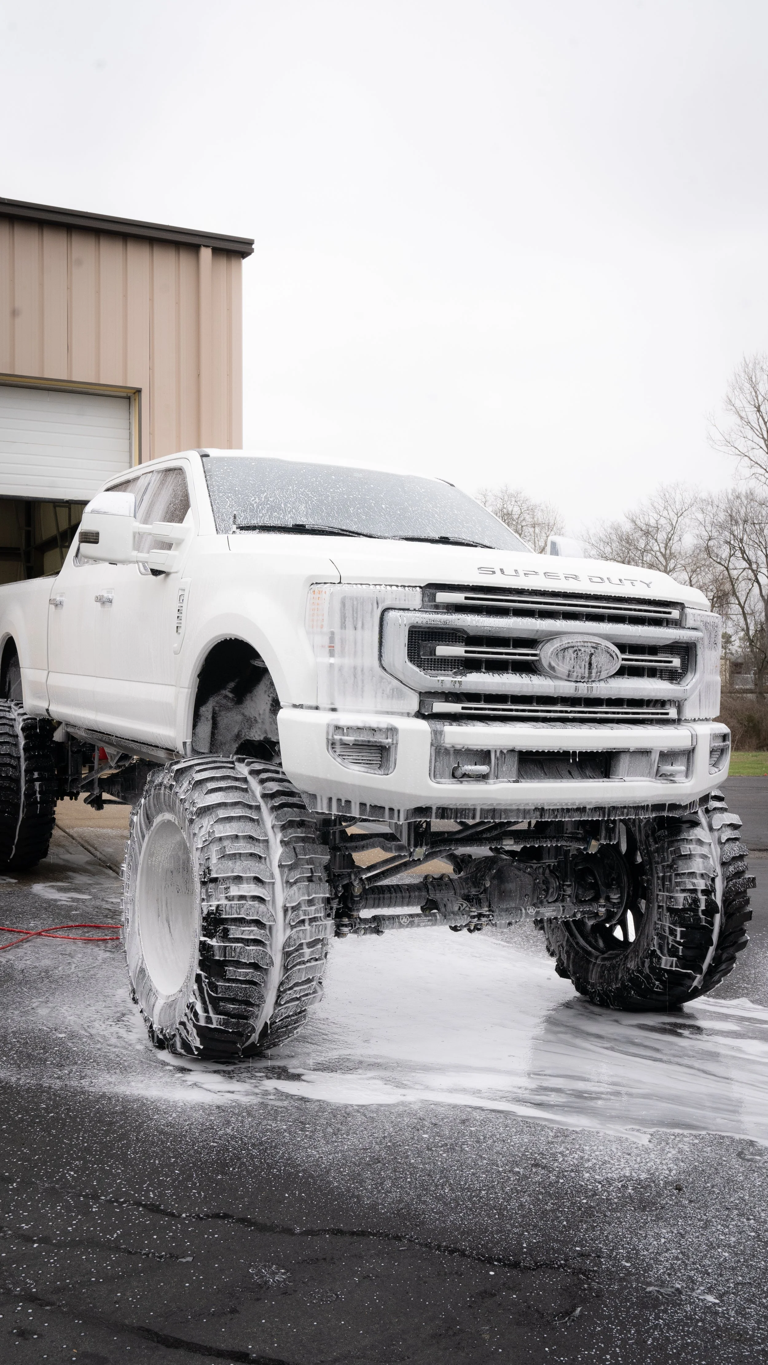 Lifted truck getting washed