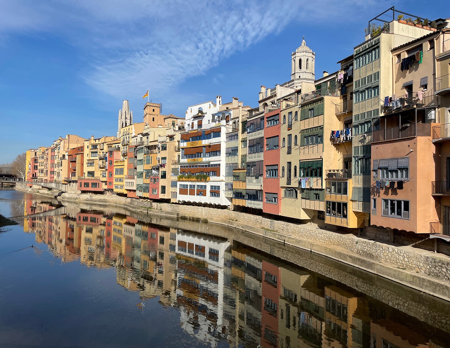 Colorful hanging houses along the Onyar River
