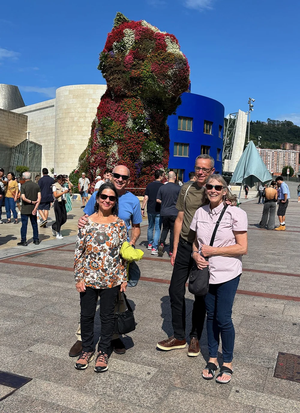 In front of the iconic “Puppy.” By artist Jeff Koons, of whose work I like nothing except this!