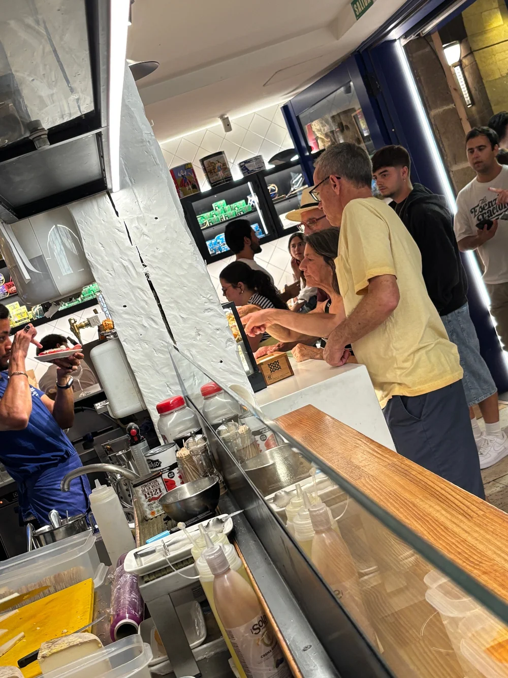 Choosing which anchovy pintxo to get.