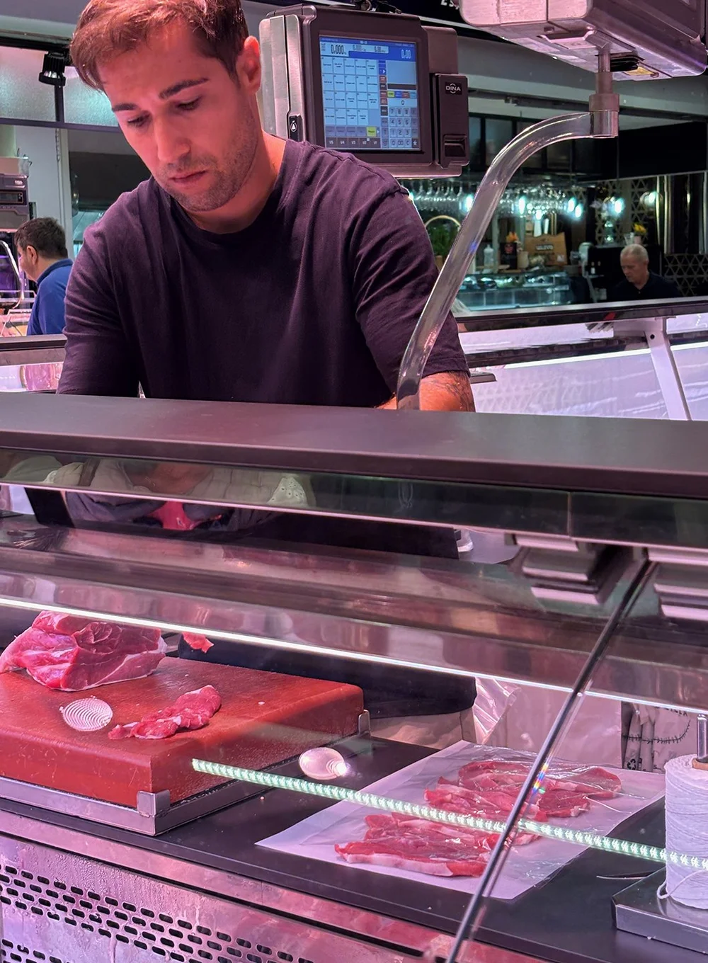 The butcher preparing slices of veal…