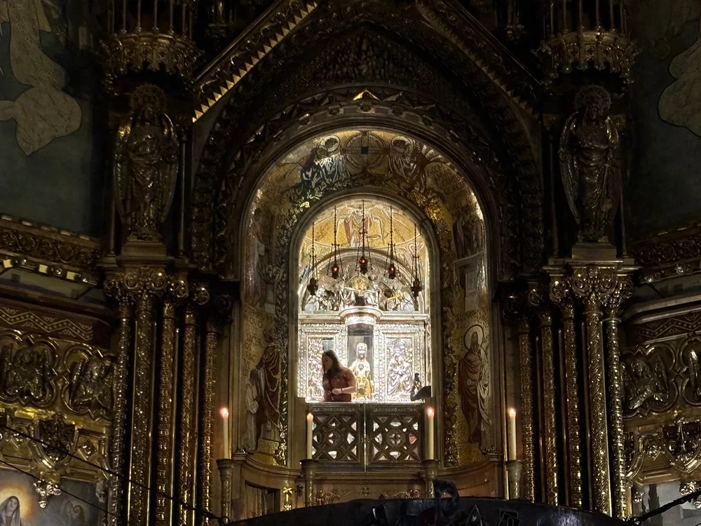 It's a small wood statue, blackened by years of smoke, apparently.