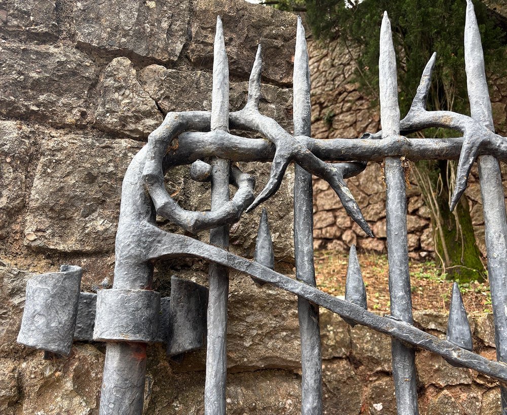 Detail of a gate along a walking path.