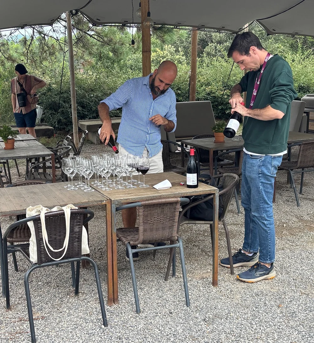 Our two guides pouring our welcome glass.