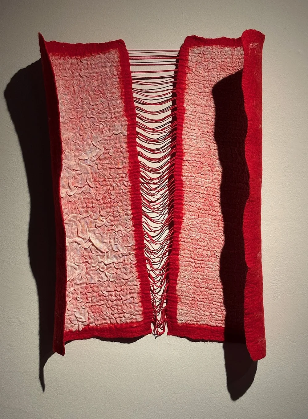 Wool and linen felted together in a technique called nuno felting.