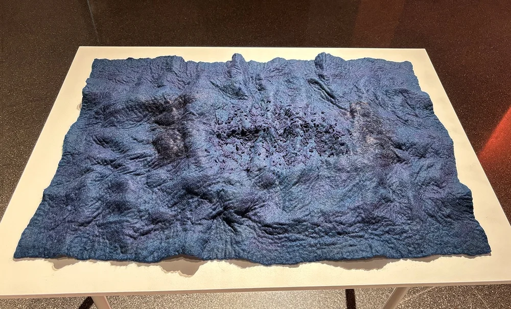 Formed to look like a topo map.