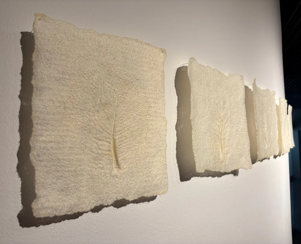 Wool felted with an impression of a leaf.