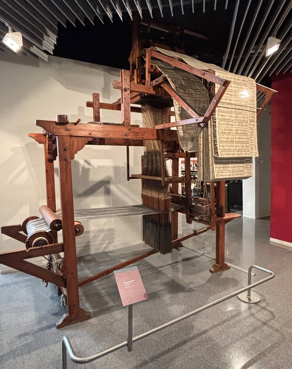 A Jacquard loom with the punch cards— like we saw in Australia!