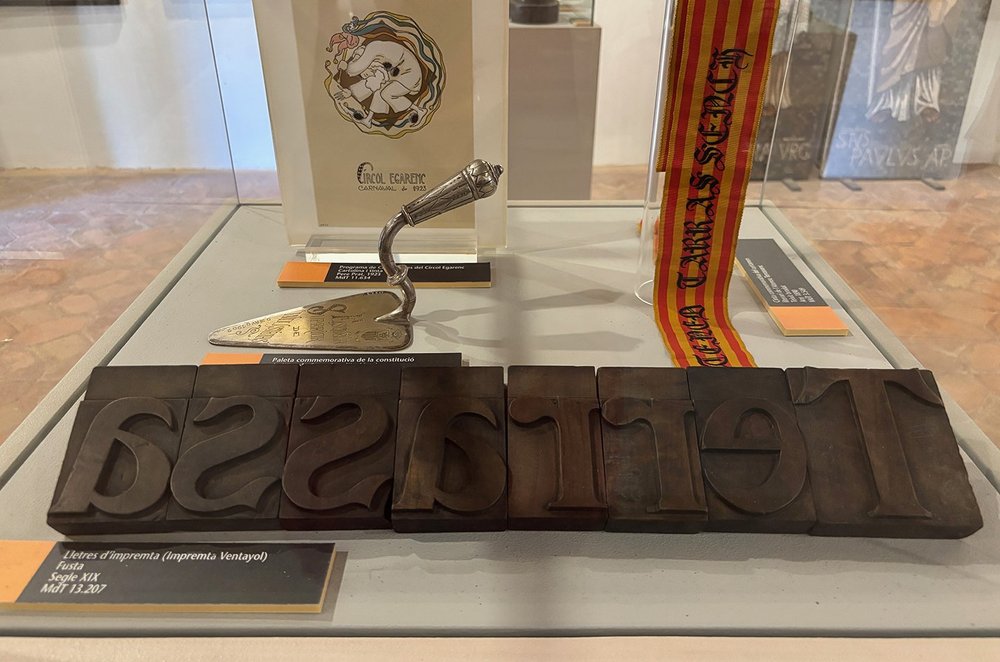 Old wood type letters spelling the town's name.