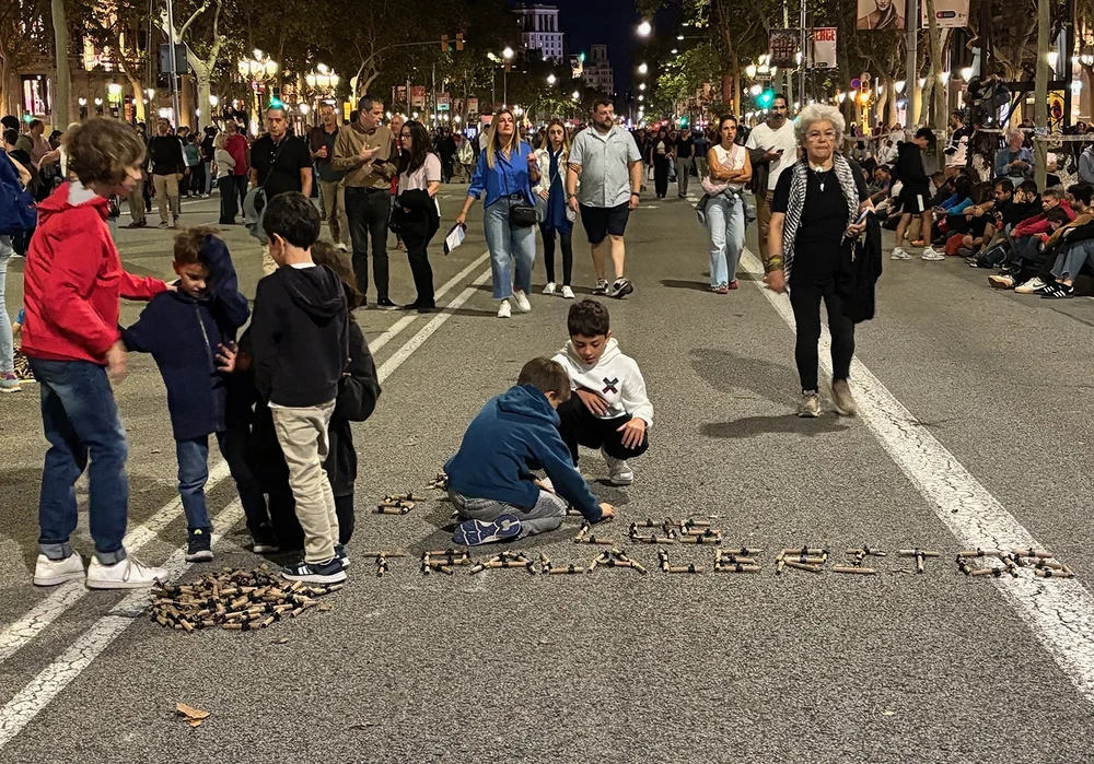 After the kid's Correfoc, kids spelling words with the spent fireworks shells!