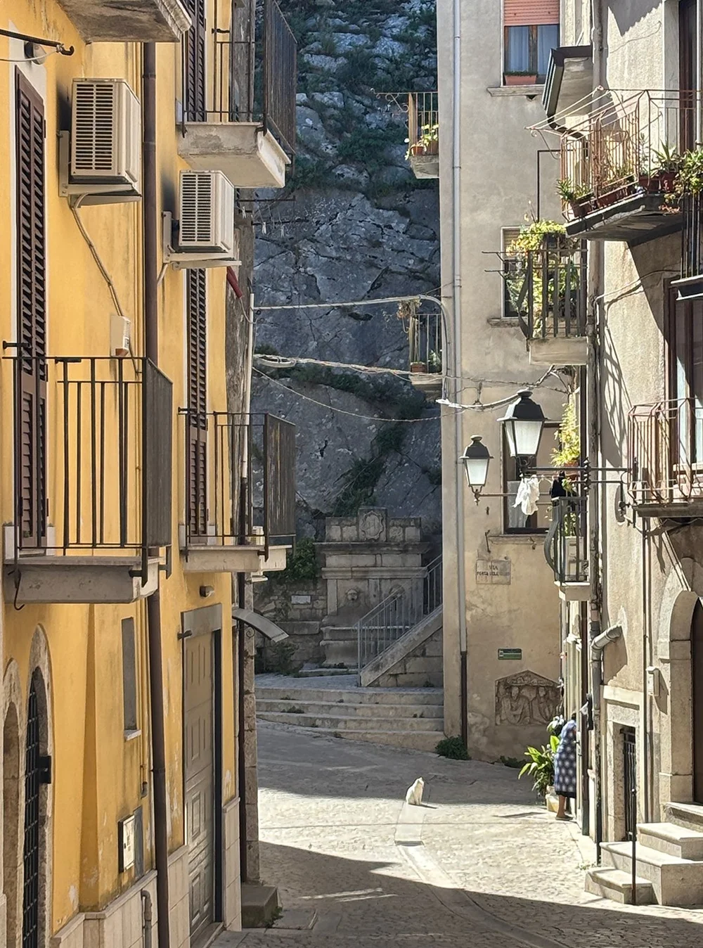 Walking through the narrow streets of the medieval village.