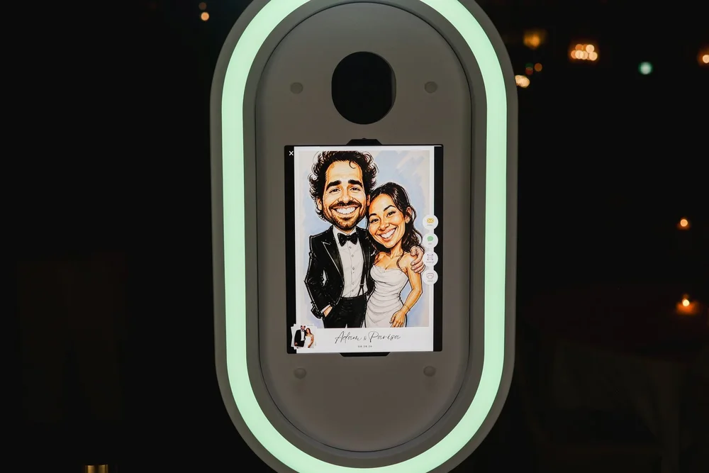 An AI photo booth turning a Winnipeg couple into a hand drawn caricature on screen