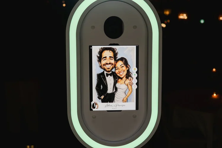 A bride and groom transformed into a caricature on the AI photo booth screen