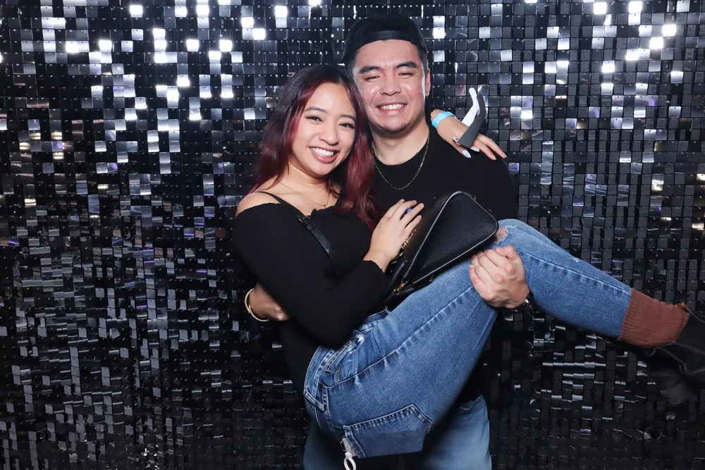 A couple in front of the Silver Shimmer wall
