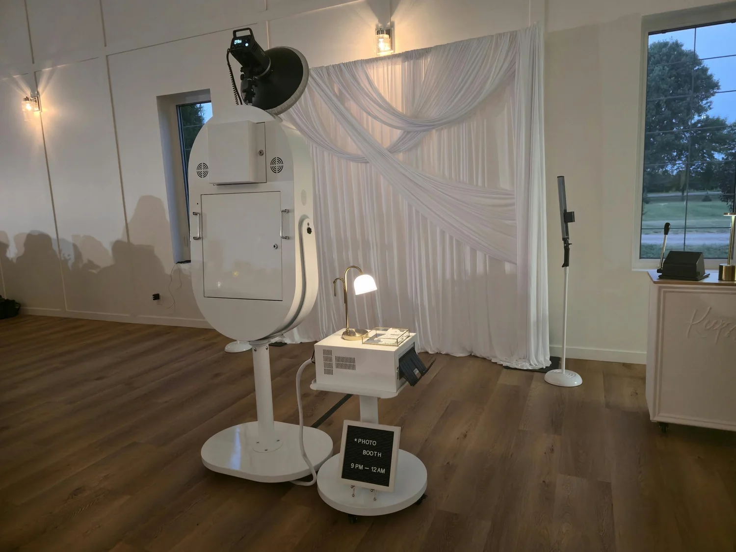 White draping behind the Luxe photo booth at a Winnipeg wedding