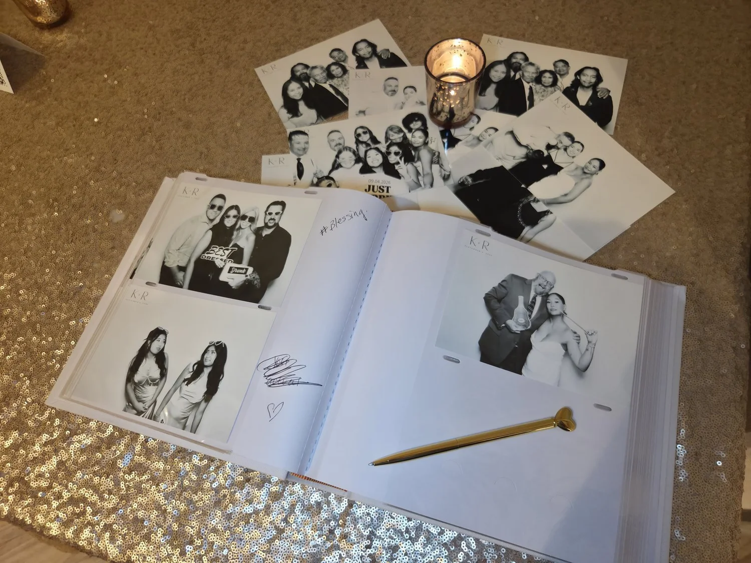 A photo guest book open to a spread of black and white strips and handwritten notes at a Winnipeg wedding