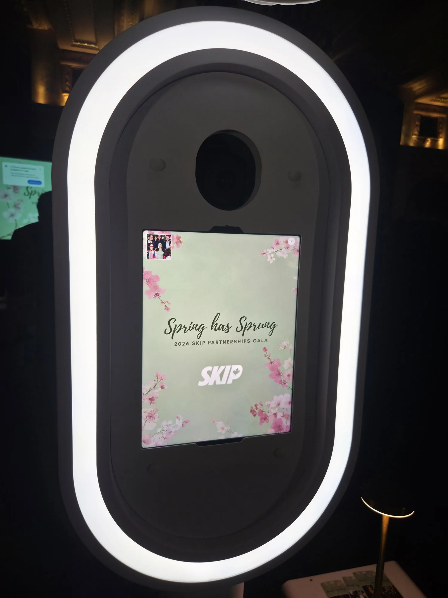 The booth's start screen carrying the client's event branding