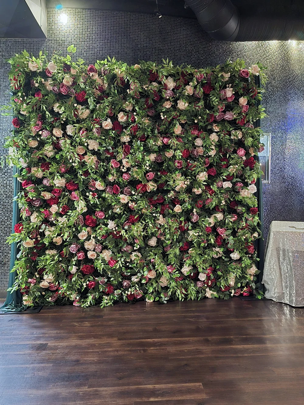 The Secret Garden flower wall set up in a Winnipeg venue