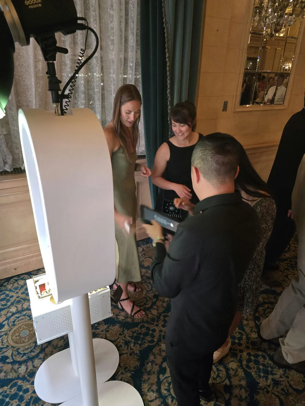 An On Que attendant helping guests at the booth at the Fort Garry Hotel