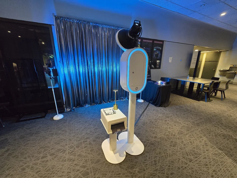Blue draping framing the Nova photo booth at a Winnipeg event