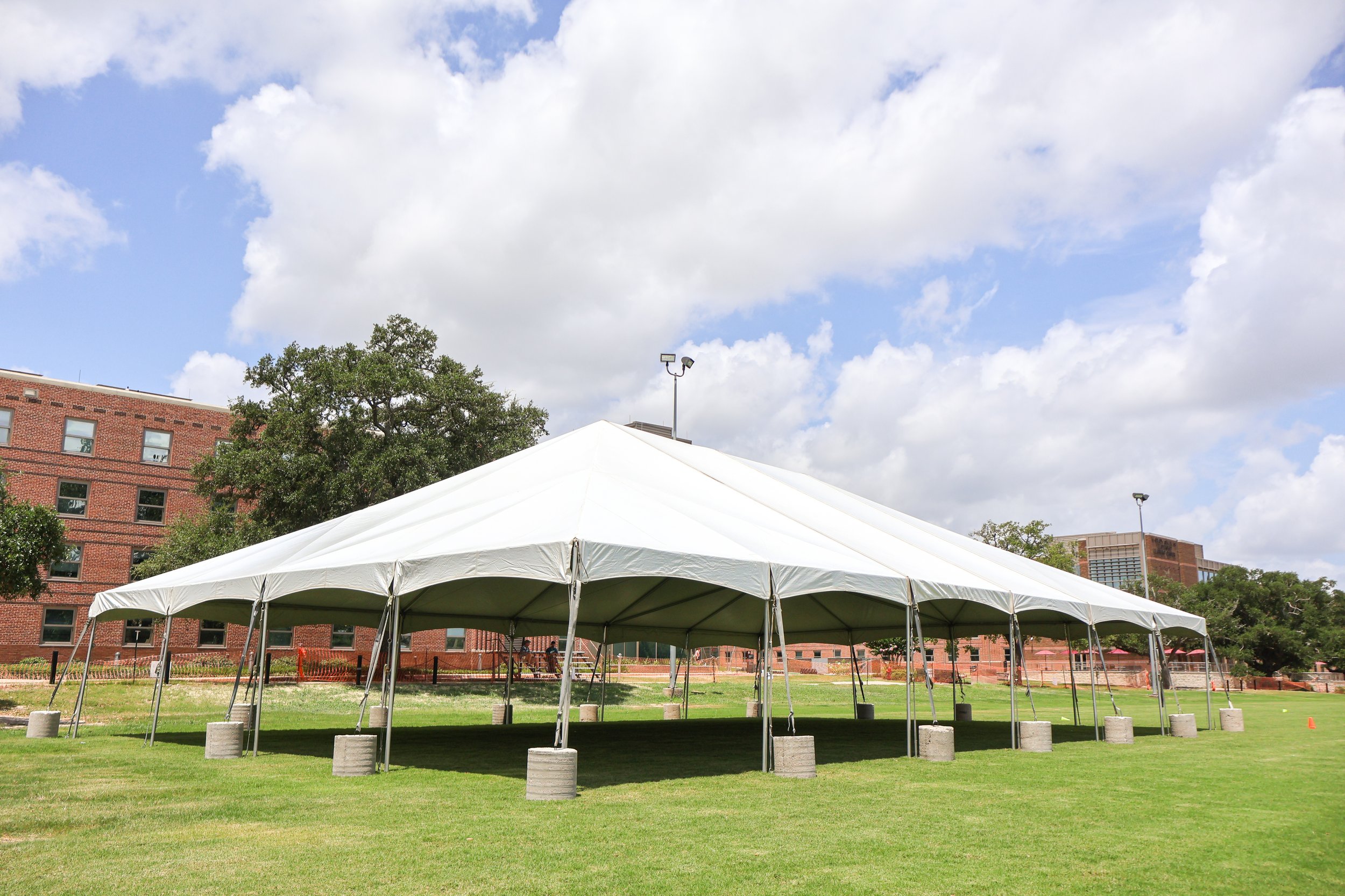 Tent anchored with concrete ballasts
