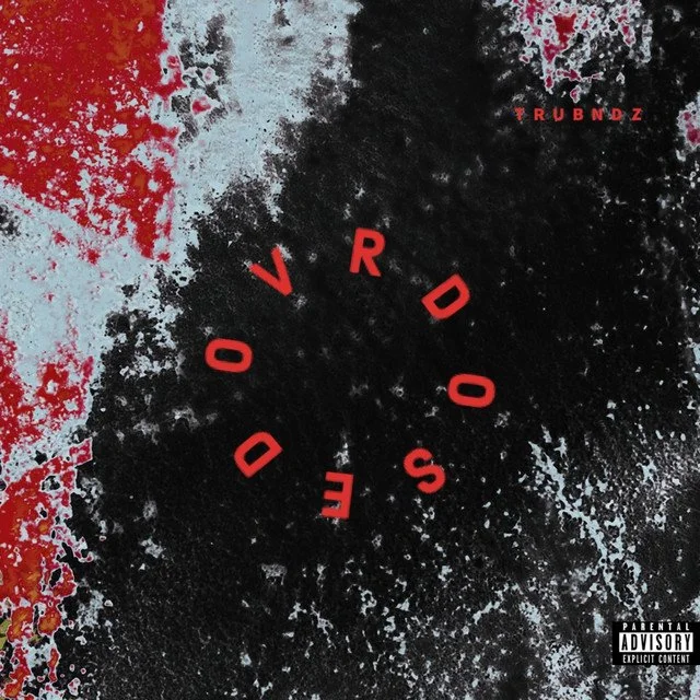 Abstract black and red textured background with red text forming a circular pattern reading 'OVERDOSE' and small red text 'TRUBNDZ' in the top right corner.