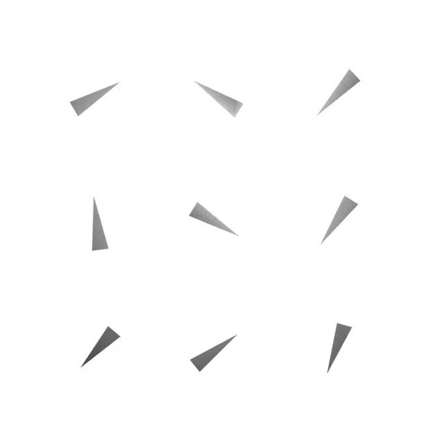 Abstract white background with scattered gray triangular shapes.